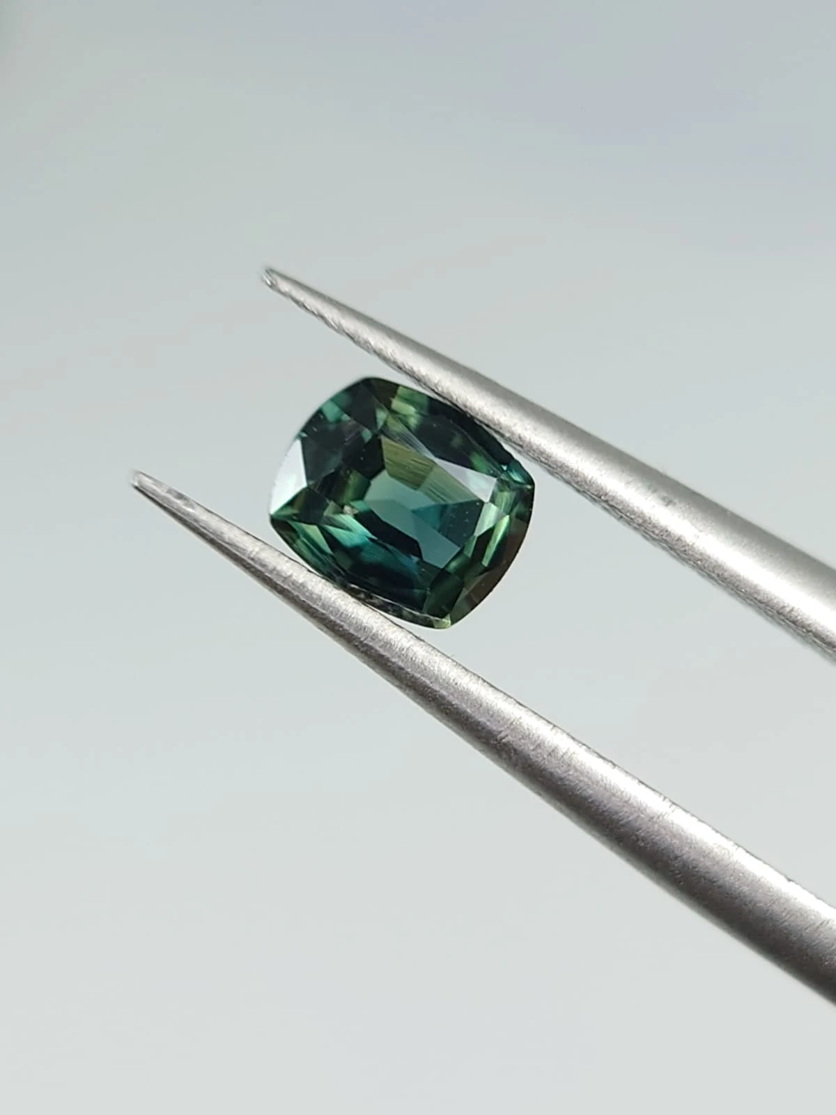 0.4ct Natural Bluish Green Sapphire from Nigeria — view 2